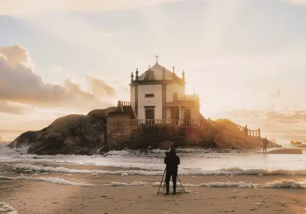 a person taking a photo of vila nova de gaia