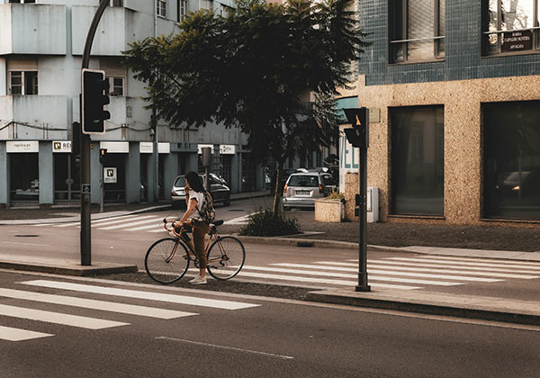 a woman riding a bike in Ramalde area of Avenida da Boavista