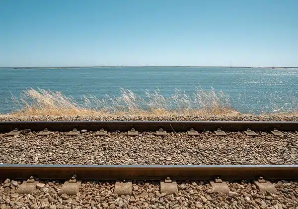 train rails in algarve near the sea