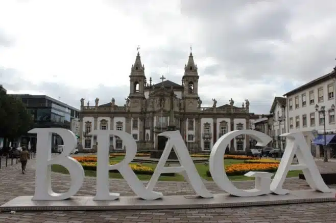 a view of a sign in braga city center near historic buildings