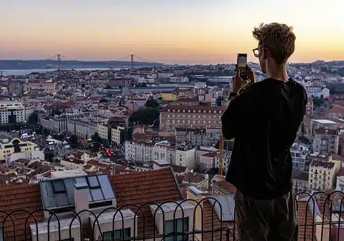 person taking a picture in one of lisbon miradouros