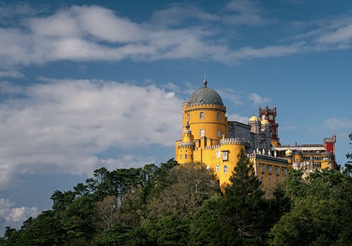 sintra palace with green forest and blue sky